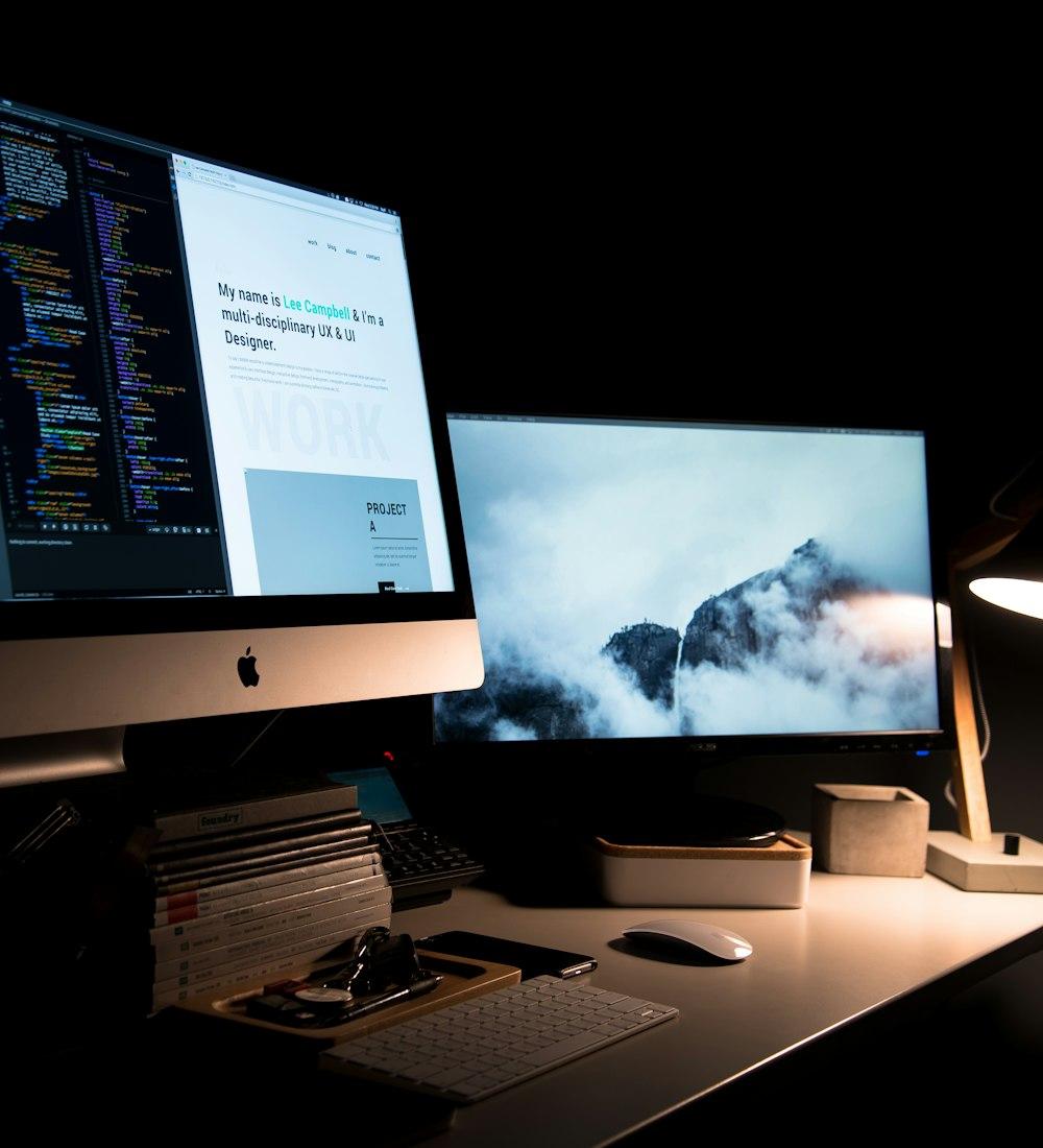 A web designer's desk with code and design work on screen